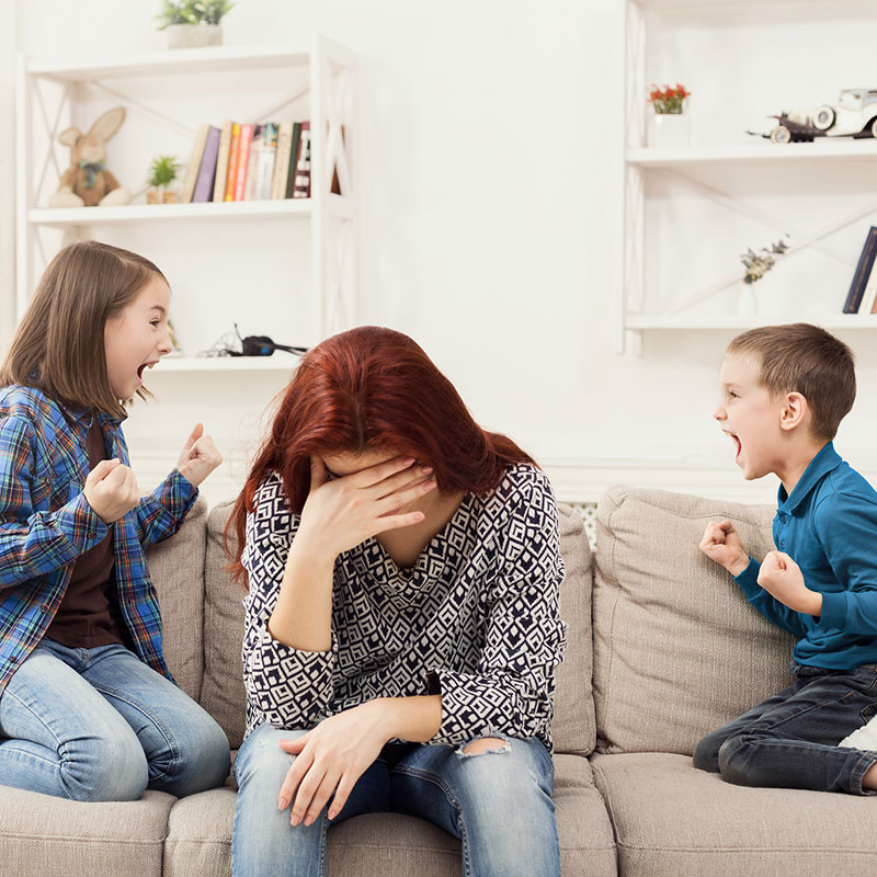 Stressed mother with children